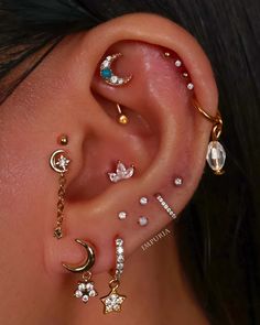 a woman with three piercings on her ear