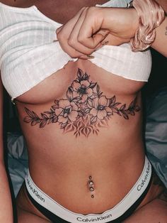 a woman's stomach with flowers on it