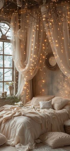 a bedroom with lights hanging from the ceiling and curtains on the windowsill above it