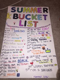 a summer bucket list is displayed on the floor