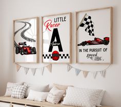 three framed racing posters hang on the wall above a bench with pillows and throw pillows