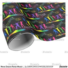 colorful dancing silhouettes on black wrapping paper with music notes and rainbow colors in the background