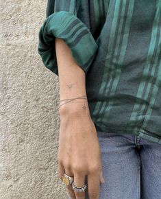 a woman with a small tattoo on her arm