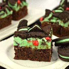 there is a piece of cake with green frosting and chocolate cookies on it, along with oreo cookies