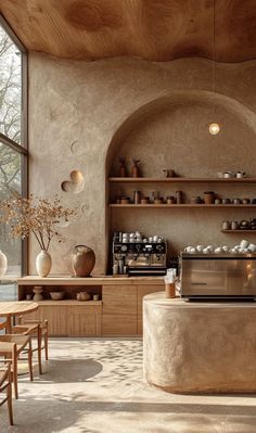 a kitchen with an oven, counter top and shelves filled with pots and pans