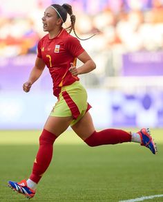 a female soccer player in action on the field