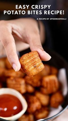 a person dipping some food into a bowl