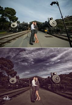 a couple kissing in front of an old train at night and then on the tracks