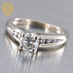 a diamond ring is sitting on top of a table