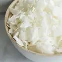 a white bowl filled with food on top of a table