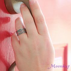 a woman's hand with a ring on it