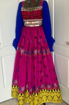 Afghan gul bakhmal dress size small  adjustable belt and zipper in back  measurment:  chest size: 36 inches dress length 56-57inches We do not accept returns or exchanges if u have any question regarding to your purchase please let us know Festive Long Bohemian Dress, Festive Bohemian Long Dress, Dabka Embroidered Maxi Dress For Festivals, Fitted Dabka Dresses For Festival, Fitted Dabka Festival Dresses, Fitted Long Dresses With Dabka Detail, Fitted Bollywood Style Fancy Dress, Bollywood Style Fitted Fancy Dress, Fitted Bollywood Dress For Fancy Occasions