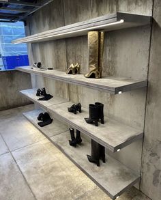 there are many pairs of shoes on the shelves