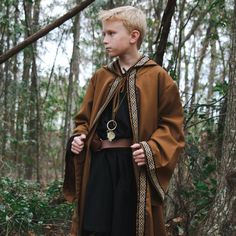 This Celtic Robe is a great costume accessory for anyone filling out a Wizard, Warlock, Medieval, Fantasy, or Renaissance costume.  Great for cosplay or LARP event.  Each robe is made from 100% polyester knit fabric with jacquard trim.  Robes are designed with large hoods and sleeves for dramatic affect. COLOR OPTIONS: Black Robe with Tan/Black Trim Brown Robe with Black/Tan Trim Tan Robe with Beige/Tan Trim Gray Robe with White/Gray Trim White Robe with Beige/Tan Trim Navy Blue with White/Grey Sorcerer Costume, Wizard With Staff, Wizard Cape, Fantasy Attire, Medieval Men, Wizard Cosplay, Wizard Robe, Wizard Outfit, Mage Robes