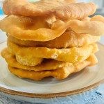 a stack of waffles sitting on top of a white plate