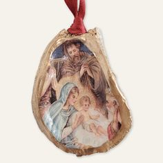 a christmas ornament with an image of the virgin mary and jesus on it