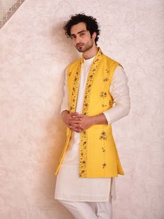 Editor's Note Featuring Canary Yellow Short Jacket With Hand Embroidered Borders And Pintuck Details. Paired With Ivory Kurta And Tapered Trousers. Fabric: Linen Silk Color: Yellow, Ivory Component: Shrug, Kurta, Trousers Care: Dry Clean Only About the Designer After establishing himself as the leading couturier in the industry of menswear, Jatin Malik went on to explore luxury footwear. You can order online these amazingly designed handmade shoes that are being offered in classy Caligae and Pes Yellow Shrug, Jatin Malik, White Outfit For Men, Haldi Outfit, Kurta Set For Men, Kurta Men, Yellow Short, Yellow Outfit, Tapered Trousers