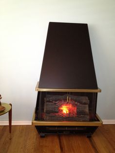 a fireplace that has some kind of fire in it