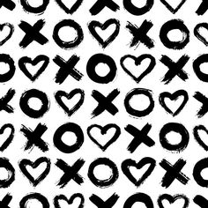 the black and white pattern has hearts, crosses, and other symbols