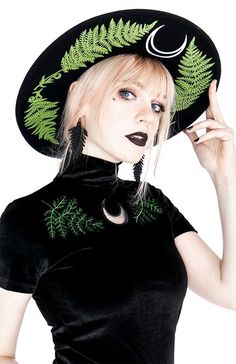 Show off your style with this unique women's embroidered gothic black velvet forest top. featuring intricate embroidery of a fern, this top will stand out from the crowd with its luxurious fabric and bold design. shop now to find your perfect fit! Luxury Embroidered Black Tops, Luxury Black Embroidered Tops, Wide Brim Hat Witch, Luxury Designer Blouse With Intricate Embroidery, Festival Top Hat, Forest Witch Top, Classic Witch Outfit, Wide Brimmed Hats For Women, Goth Wide Brim Hat