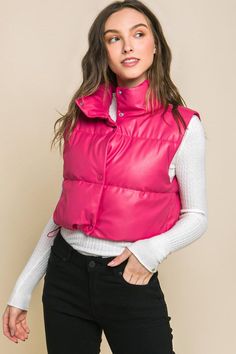 Add a touch of edgy style to your casual outfits with our PU Faux Leather Puffer Vest. This trendy puffer vest is perfect for layering over your favorite tops. This is a versatile and must-have addition to your casual wardrobe, perfect for staying warm and fashionable during cooler days. SPECIFICATIONS: Model Spec: Model is 5' 7" wearing a size small. Style: Casual Print / Pattern: PU Faux Silhouette: Puffer Vest Fit: Regular Embellishment: Button Neck Line: Collar Sleeve: Sleeveless Length: Cro Faux Leather Puffer Vest, Leather Puffer Vest, Leather Button Up, Leather Puffer, Cropped Vest, Edgy Style, Simple Tees, Leather Vest, Puffer Vest