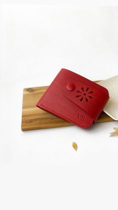 "Red personalized wallet for women is suitable for carrying in your hand or in your pocket.  It is small wallet with 100% leather to serve you for a long time.   It is small, lightweight, fits in your pocket.  This is a wonderful personalized gift for your loved one. Minimalist wallet women that combines elegance, classic and casual style. The custom wallet is made of genuine red leather the wallet is stitched with red thread and made by hand with French stitching.  The edges of the wallet are painted red and polished. The small personalized wallet make a beautiful gift for mother birthday gift, wife birthday gift, sister birthday gift. Wallet description:   - Genuine Italian leather   -  color  red   -  3 card slots   -  1 pockets for money    -  1 pocket for change with buttons with is l Small Leather Purse, Red Wallet, Custom Wallet, Personalized Wallet, Mother Birthday Gifts, Birthday Gifts For Sister, Minimalist Wallet, Clip Wallet, Small Wallet