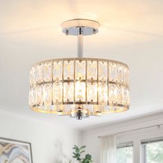 a chandelier hanging from the ceiling in a living room