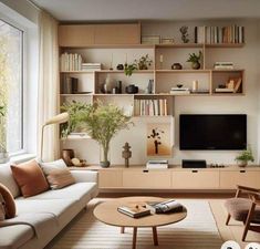 a living room filled with furniture and a flat screen tv on top of a wooden shelf