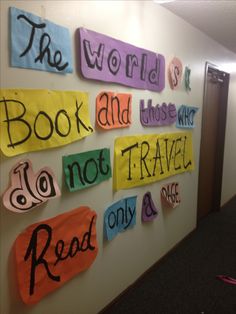 colorful bulletin board with the words book and those who do not travel read only & don't