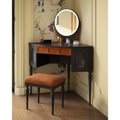 a dressing table with a mirror and stool