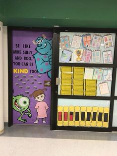 there is a bookcase with books and magnets on the front door to children's library