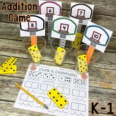 the addition game is set up with dices and pencils to make them look like they