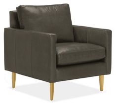 a brown leather chair with wooden legs