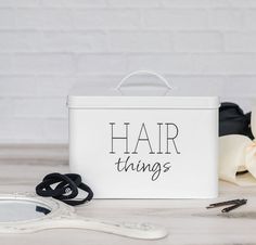 "Maintain Your Space Mess-Free With The Most Practical Hair Things Accessory Storage Box! Looking for a hair product organizer to keep your bathroom countertop clean? Want a scrunchie holder with a lid to store all your favorite hair ties? Need a stunning hair bow container for girls to treat your daughter? Now you don't have to settle for a cheaply-made hair tool organizer, an old-fashioned bathroom cabinet organizer for your hair essentials, or a bulky hair tie container that will take up all Hair Tie Storage, Product Organizer, Bathroom Cabinet Organizer, Hair Tool Storage, Scrunchie Holder, Hair Tie Holder, Styling Essentials, Vanity Shelf, Metal Organizer