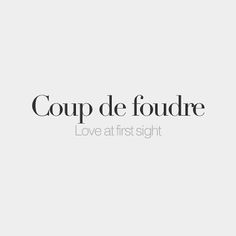 the words'coup de foudre love at first sight'are in black and white