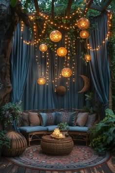 an outdoor seating area with lights hanging from the ceiling