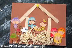 a nativity scene made out of paper and wood sticks