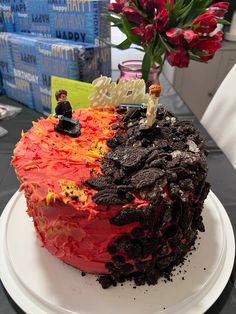 there is a cake that looks like it has two people on top