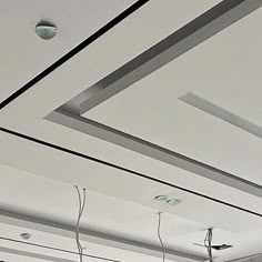 several suspended lights are hanging from the ceiling