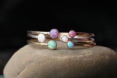 "♥This is my favorite bracelet to wear! This new adjustable bracelet matches my new adjustable opal rings. This bracelet is made entirely from scratch, so it has a beautiful artisan look to it! ★ALSO AVAILABLE IN STERLING SILVER AND ROSE GOLD! https://www.etsy.com/shop/galwaydesigns?ref=seller-platform-mcnav&section_id=8125392 The bracelet has a nice thickness of 3.4mm wide, but still dainty enough to be slightly adjusted. This bracelet is made entirely out of 14K yellow gold-filled. I have Adjustable Nickel-free Opal Jewelry, Adjustable Round Opal Bracelets, Adjustable Opal Round Bracelets, Adjustable Opal Bracelet Gift, Adjustable Opal Bracelet For Gift, Dainty Adjustable Opal Bracelet, October Jewelry, Dual Birthstone Ring, Opal Bangle