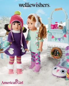 two dolls standing next to each other in the snow