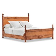 a wooden bed with white linens and pillows on it's headboard, against a white background