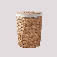 a large woven basket with a white lid