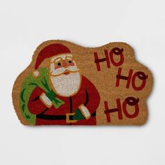 a santa clause door mat with the words ho hoo written in red and green