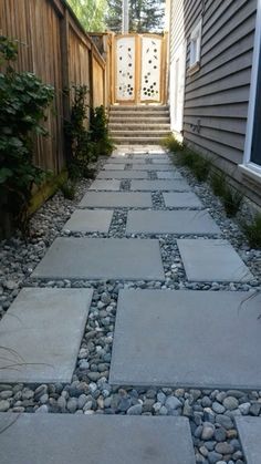 a stone path leading up to a house