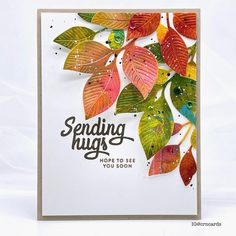 a card with leaves on it and the words sending high above them is written in black ink