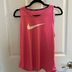 Nike Dry Fit Pink Workout Tank Top Size M Pink Crew Neck Tank Top For Sports, Sleeveless Running Tops For Spring, Nike Pink Training Tops, Nike Pink Gym Tops, Nike Pink Tops For Gym, Nike Training Tops For Spring, Spring Training Nike Tops, Nike Sporty Pink Tank Top, White Training Tops For Spring