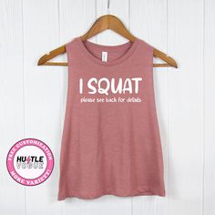 Add a touch of humor to your workout with our Funny Squat Shirt. With the phrase "I Squat," turn around for the amusing details. This funny workout tee is a perfect addition to your workout outfit.  ---------------------------------------------------------- 𝐌𝐨𝐫𝐞 𝐜𝐨𝐥𝐨𝐫 & 𝐒𝐡𝐢𝐫𝐭 𝐨𝐩𝐭𝐢𝐨𝐧𝐬 ➤ https://www.etsy.com/shop/HustleVogue 𝐍𝐎𝐓𝐄: Prior to placing your order, please verify the color availability for each shirt type displayed on the listing image. -------------------------- Sporty Yoga T-shirt With Letter Print, Sporty T-shirt With Funny Text For Sports, Short Sleeve Gym Top With Funny Text, Relaxed Fit Activewear With Text Print For Workout, Funny Text Short Sleeve Gym Tops, Sporty Workout T-shirt With Funny Text, Athleisure Gym Activewear With Text Print, Funny Text Crew Neck Gym Top, Funny Text Crew Neck Top For Gym