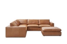 a brown leather sectional sofa with ottoman and footstool on white background, side view