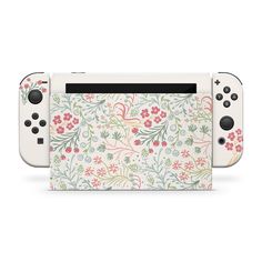 an image of a nintendo wii game console with floral design on the front and side